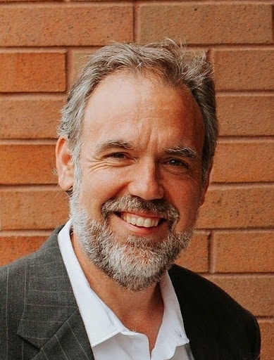 Headshot of a man smiling