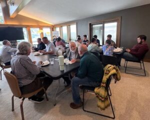 Group of men at a table having lunch and talking